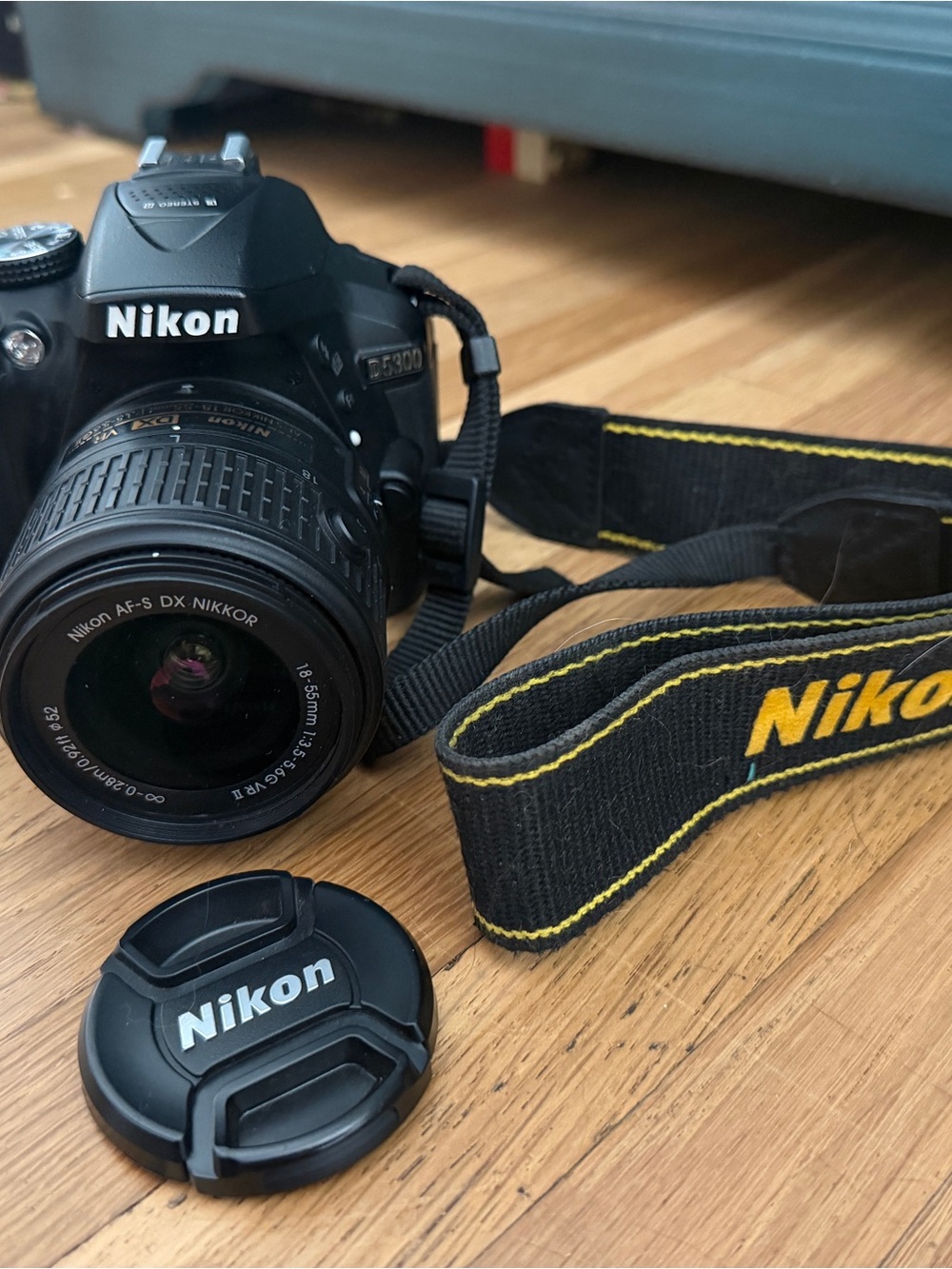 Nikon D3000 DSLR Camera in Black with Yellow-Trim Strap